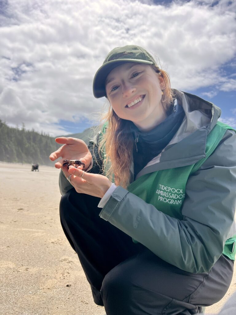 NCLC intern Annika Larson holds a purple shore crab at Short Sand Beach, along the Cape Falcon Marine Reserve.